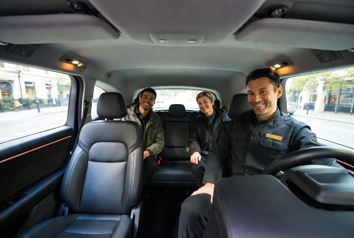 Friendly driver and passengers enjoying a private Belfast taxi tour